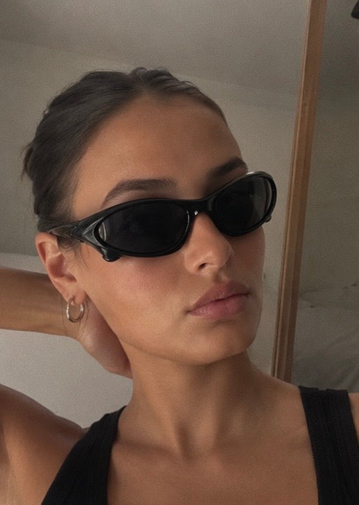 The Velocity Sunglasses in gloss black worn, side profile