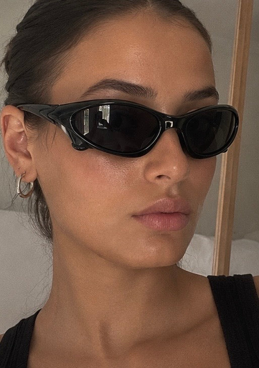 The Velocity Sunglasses in gloss black worn, three-quarter view