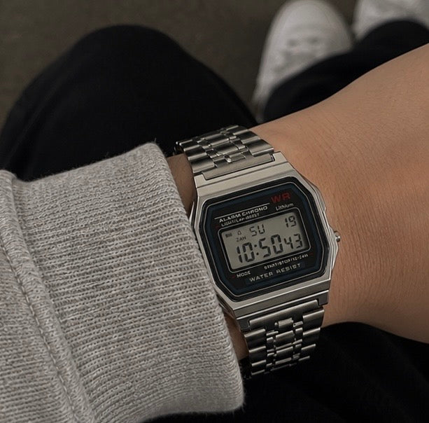 The Retro Digital Watch in silver, worn on wrist