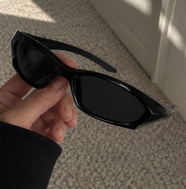 The Apex Sunglasses in jet black, three-quarter view