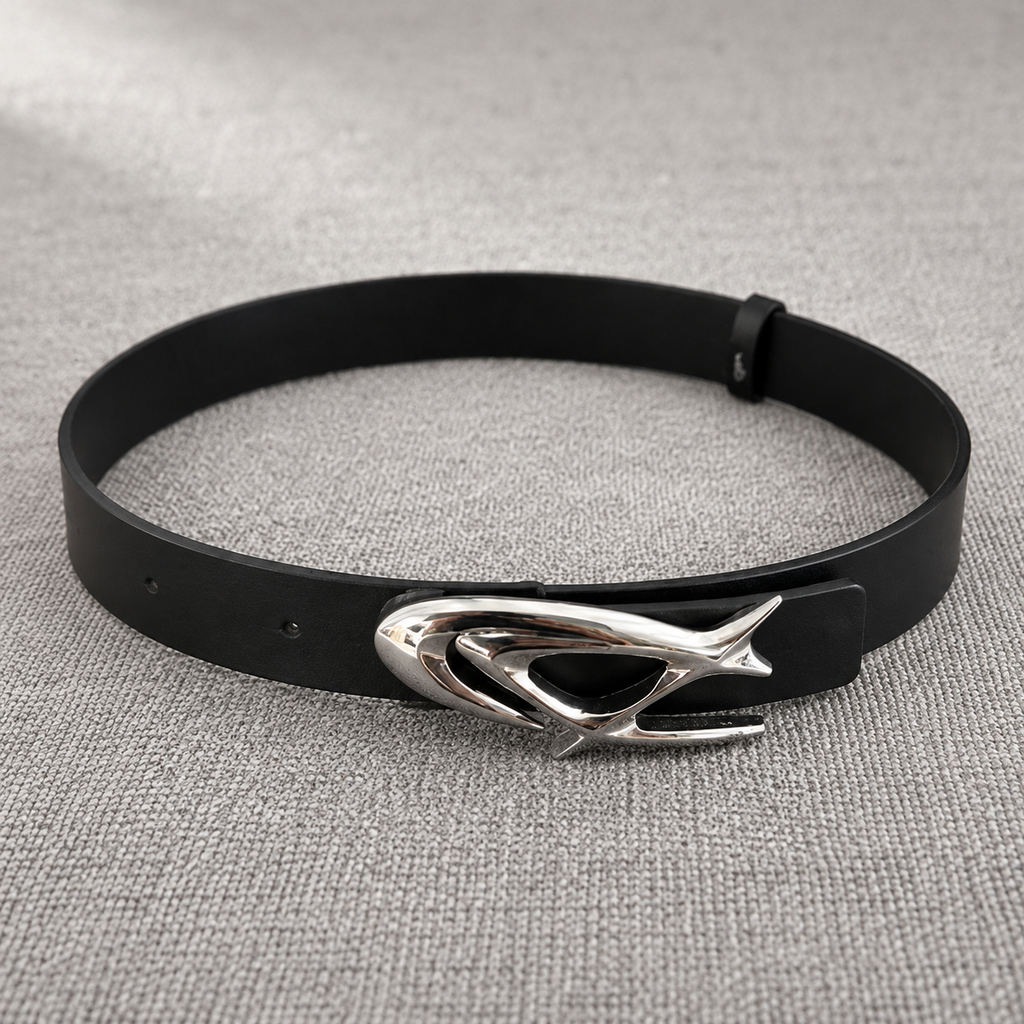 STNDOUT belt laid flat on grey textured surface