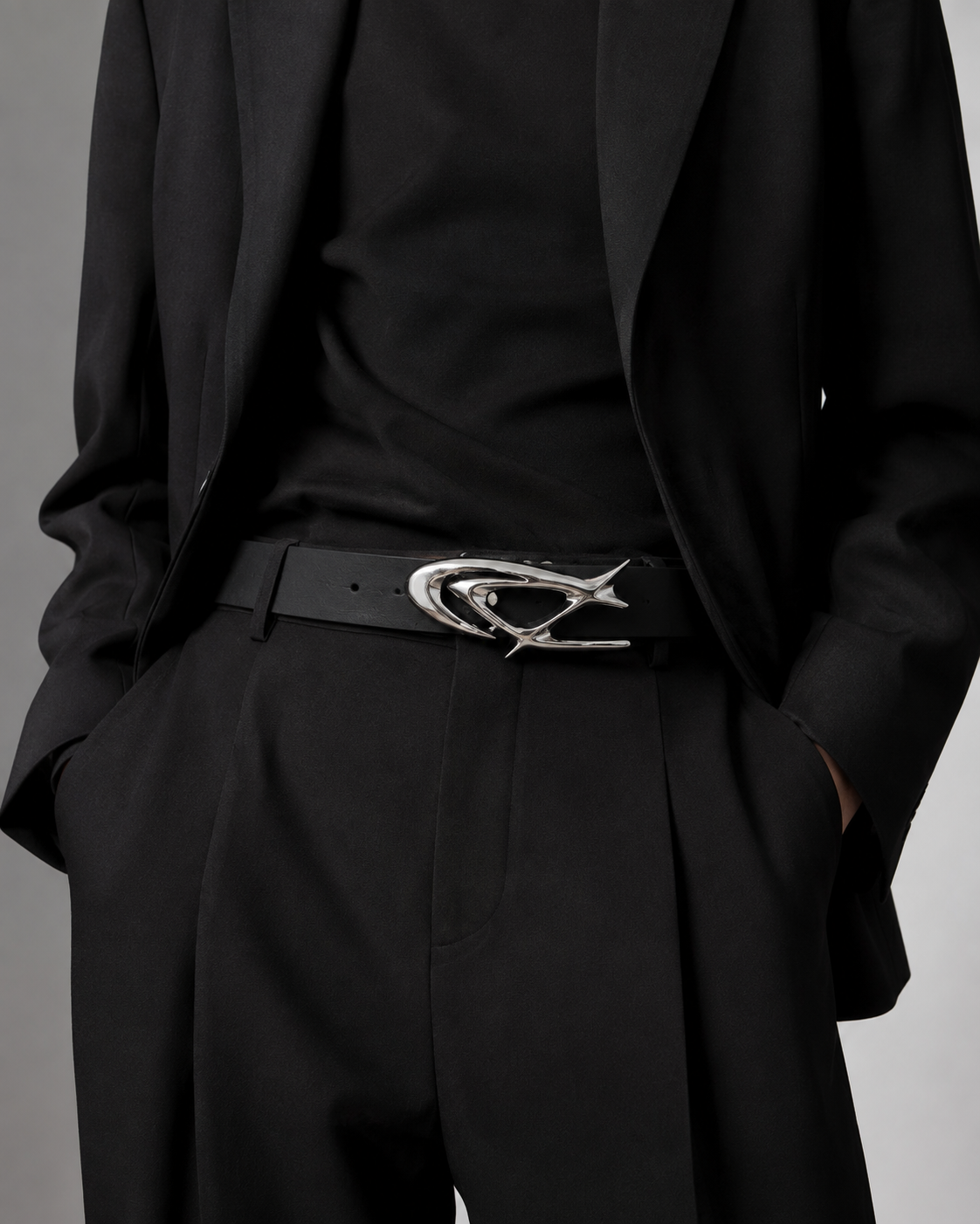 STNDOUT belt worn with tailored black outfit